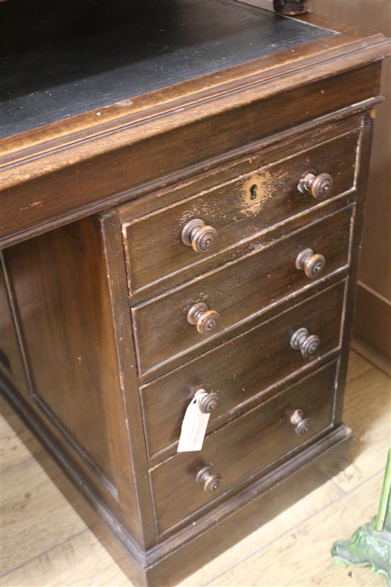 An early 20th century oak pedestal desk, W.143cm